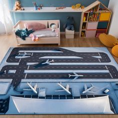 a child's play room with toy airplanes on the floor and toys in the background