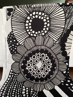 a black and white artwork with circles on it