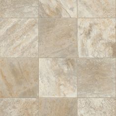 a tile floor that is made up of different types of tiles, including beige and white