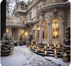 a large house covered in snow with lit candles on the steps and trees around it