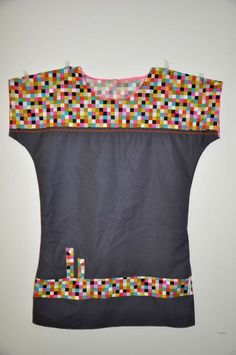 a piece of clothing that has been made out of different colored squares on the back