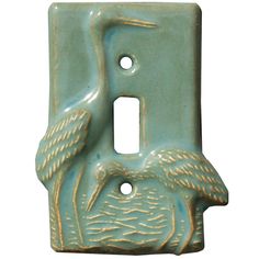 a light switch cover with two birds on it