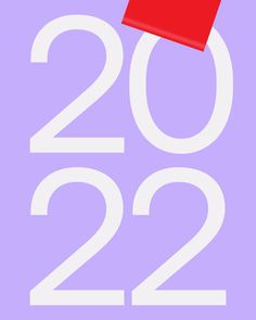 a red piece of paper with the number twenty two in white on a purple background