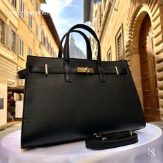 High-end Rectangular Leather Bag, Elegant Leather Shoulder Satchel, Elegant Smooth Grain Shoulder Bag, Elegant Tote Bag With Leather Lining, Elegant Rectangular Satchel With Leather Lining, Luxury Smooth Grain Satchel Shoulder Bag, Elegant Rectangular Calf Leather Shoulder Bag, Elegant Shoulder Bag With Double Handle And Leather Lining, Elegant Everyday Satchel With Leather Lining