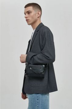 Meet your new go-to accessory: the Crossbody Box Bag with Attached Chain Detail, where style meets practicality.

Crafted with an edgy mix of textures and a thoughtfully designed pattern, this bag is made for those who appreciate a touch of moody sophistication. The exterior boasts a durable, grainy finish complemented by a bold chain detail, offering a juxtaposition of nonchalance and polish. Inside, the bag features a neatly organized compartment with a dedicated space to secure your essential Modern Box Bag With Chain Strap, Modern Clutch Box Bag With Chain Strap, Edgy Rectangular Shoulder Bag With Chain Strap, Modern Crossbody Box Bag With Chain Strap, Modern Box Bag With Chain Strap For Everyday Use, Rectangular Bag With Double Chain For Everyday Use, Modern Leather Box Bag With Chain Strap, Urban Wear, Box Bag