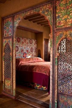 an intricately decorated bed in a bedroom