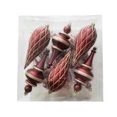 red and gold christmas ornaments in plastic package