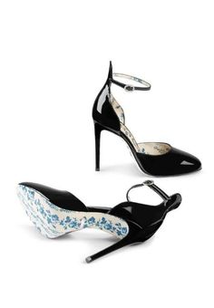 The patent leather pump is designed with a rounded toe and back detail that extends up past the ankle, ending in an ankle strap with crystal buckle closure. The blue rosebud printed lining and sole Black patent leather. Blue rosebuds and Gucci print leather lining. Blue rosebuds print leather sole. Rounded point toe. Adjustable ankle strap with crystal buckle. 4.1"/105mm heel. Composition: Crystal 100%, Patent Leather 100%Lining: Leather 100%Sole: Leather 100%Made in Italy. Gucci Heels With Sculpted Heel For Spring, Gucci Spring Heels With Sculpted Heel, Gucci Formal Heels With Heel Strap, Gucci Heels For Spring Formal, Gucci Fitted High Heels, Gucci Black Heels With Sculpted Heel, Black Gucci Heels With Sculpted Heel, Gucci Heels With Ankle Strap And Heel Strap, Gucci Heels With Ankle And Heel Strap