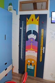 this is a kid's room with a door decorated like cartoon characters