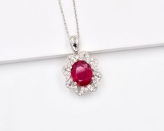 "6 CT Natural Ruby Pendant Necklace, 925 Sterling Silver, Solitaire Pendant, Charm Pendant, July Birthstone,  Pendant, Gift For Her. ►Made of solid sterling silver with a rhodium finish (925) ● Code --- PD-188 ● Main Stone --- Natural Ruby ● Birthstone Month --- July ● Color --- Red ● Gem Size --- 10x12 MM ● Carat Weight --- 6 ct. (approx.) ● Total Weight --- 6.70 Gram ● Gemstone Creation --- 100% Natural ● Accented Stone --- White Topaz ● Pendant Length --- 1.10 Inch  ● Pendant  Width --- 0.60 Fine Jewelry Pendant Necklace With Center Stone, Sterling Silver Necklace With Center Stone For Weddings, White Gold Pendant Jewelry With Center Stone, Wedding Necklace With Round Pendant And Center Stone, Round Diamond Necklaces With Center Stone For Wedding, Round Diamond Necklace With Center Stone For Wedding, Round Wedding Necklace With Center Stone, Round Center Stone Wedding Necklace, Sterling Silver Pendant With Center Stone