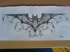 a drawing of a bat on a piece of paper