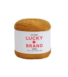 a ball of lucky brand yarn on a white background with the label for lucky brand