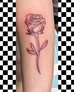 a rose tattoo on the arm