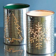 two tin canisters sitting next to each other