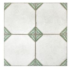 a white and green tile pattern on the floor