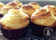 several cupcakes are sitting on a cooling rack