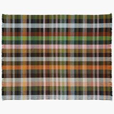 a multicolored plaid rug with fringes on the bottom and one green, yellow, brown, white and black checkered pattern