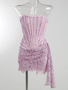 a mannequin wearing a pink lace dress