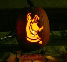 a carved pumpkin with an image of winnie the pooh on it's face