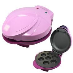 a pink and black muffin maker with six cupcake pans in the bottom