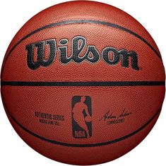 a close up of a basketball with the word wilson written on it and an image of a man holding a basketball