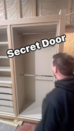 a man standing in front of a closet with the words secret door written on it