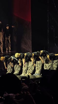 a group of people standing on top of a stage