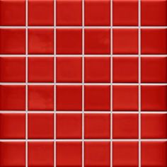 a red tiled wall with white squares