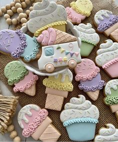 some decorated cookies are sitting on a table