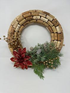 a wreath made out of wine corks and pine cones