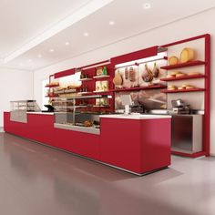 a red and white counter in a restaurant with shelves filled with pastries on it