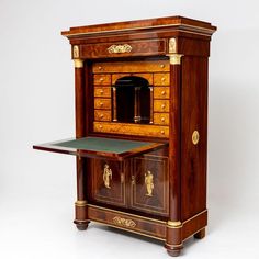 an old fashioned wooden desk with drawers