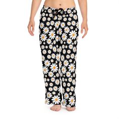 Introducing our radiant Women's Sunflower Pattern Pajama Pants, where comfort meets charm! Embrace leisure in style with these cozy bottoms, meticulously crafted to elevate your lounging experience. Crafted from the finest quality cotton blend, these pajama pants offer unmatched softness against your skin, ensuring a luxurious feel all day and night. The breathable fabric keeps you cool and comfortable, making them perfect for lounging around the house or enjoying a peaceful night's sleep. What Cotton Bottoms With Floral Print For Loungewear, Relaxed Fit Floral Bottoms For Loungewear, Floral Print Cotton Bottoms For Pajama Party, Cotton Floral Print Bottoms For Pajama Party, Floral Print Relaxed Fit Bottoms For Pajama Party, Floral Print Long Pants For Pajama Party, Cotton Daisy Print Bottoms, Floral Print Full-length Loungewear Pants, Comfortable Full-length Summer Sleepwear