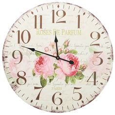 a white clock with pink flowers on it's face and the words roses de parum written in french