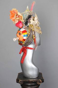 This is a one of a kind piece of wearable art made for the Five and Diamond Seventh Annual Headgear Art Show and shown on August 2, 2019. There is a lot of symbolism around white butterflies. If the first butterfly you see in the year is white you will have good luck all year. White butterflies are symbols of spiritual change. In the Philippines, seeing a white butterfly means that there is a message coming. In Ireland, they were thought to carry the souls of dead children. To the Blackfoot, the Traditional Handmade Headpieces For Carnival, Handmade Costume Headpieces For Festivals, Handmade Headpieces For Costume Festivals, Handmade Unique Headpiece For Festivals, Unique Headpieces For Carnival Festival, Unique Handmade Ceremonial Headpieces, Traditional Handmade Carnival Headpieces, Unique Handmade Headpiece For Carnival, Handmade Festival Costume Headpieces