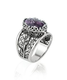 "This 925 Sterling Silver Women Embroidery Cocktail Ring is the perfect gift for her. With its Filigree Art Tulip Detailed Gift Ring design and dark purple Amethyst Gemstone, it's perfect for any occasion.        The Amethyst Gemstone is 10X14 mm, double side faceted, checkerboard oval-cut and the ring face length is 0.60\" / 15.00 mm and width is 0.45\" / 11.50 mm.          Embellish your fingers with enchanting details. Delicate and feminine, this ring features stunning lace-like details. The perfect finishing touch to any outfit, this ring is also great for everyday use. With its beautiful purple stone and delicate silverwork, this ring is a true stunner. Give the gift of elegance this holiday season. It could be your Christmas, New Year, Thanksgiving, Birthday, Anniversary, Mother`s Da Luxury Silver Amethyst Ring Modern Style, The Ring Face, Silver Polish, Blue Stone Ring, Blue Topaz Stone, Box Making, Statement Ring Silver, Sterling Silver Filigree, Velvet Pouch