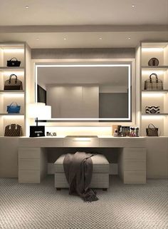 a dressing room with lights on the wall and several purses in front of it