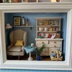 a doll house with furniture and accessories in it