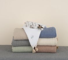 a stack of folded towels on top of each other