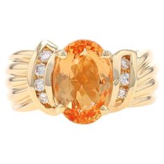 Size: 7 Sizing Fee: Up 2 sizes for $80 or Down 1 size for $60 Metal Content: 14k Yellow Gold Stone Information Natural Precious Topaz Treatment: Routinely Enhanced Carat(s): 3.62ct Cut: Oval Color: Light Orange Natural Diamonds Carat(s): .24ctw Cut: Round Brilliant Color: I - J Clarity: VS2 - SI1 Total Carats: 3.86ctw Style: Solitaire with Accents Bypass Features: Channel Set Diamond Accents & Ribbed Shoulder Detailing Measurements Face Height (north to south): 15/32" (11.5mm) Rise Above Finger: Topaz Diamond Ring, Topaz And Diamond Ring, Gold Stone, Channel Set, Light Orange, Cocktail Rings, Round Brilliant, Natural Diamonds, Topaz