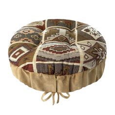 a round floor pillow that is made out of various colors and patterns, with ties at the bottom