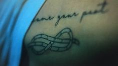 a woman with a tattoo on her arm that says, i love you fast and an image of a knot