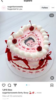 the cake is decorated with white icing and red ribbon around it's edges