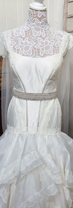 This Wide Beaded Wedding Belt measures 19 inches long and 1.65 inches wide. The decorated section is made entirely of rhinestones, faux pearls and clear beads. An ivory ribbon in the back allows you to tie this to whatever tightness you prefer (120 inches), and everything is lined in felt so it's sturdy and comfortable. Like our Facebook page and receive a 10% discount when you message me before checkout! Everything made by handmade MKE is one of a kind and unique, however, if you would like a d Bedazzled White Bridal Belt For Wedding, White Rhinestone Bridal Belt, Fitted Rhinestone Bridal Belt For Wedding, White Crystal Embellished Bridal Sash, White Embellished Fitted Sash, Embellished Fitted Bridal Belt, Fitted Wedding Dress With Rhinestones, Embellished Fitted Bridal Belt For Wedding, Fitted Embellished Bridal Belt For Wedding