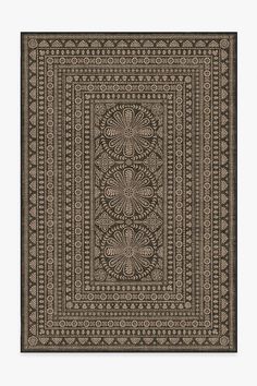 a black and white rug with an intricate design