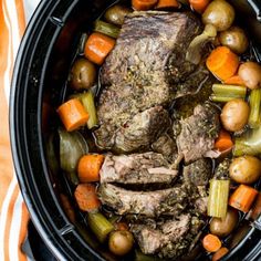 pot roast with carrots, celery, and potatoes in the slow cooker