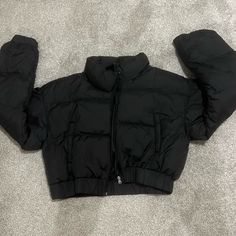 Never Worn Didn’t Come With A Tag But It’s A M Black Fitted Long Sleeve Puffer Jacket, Trendy Black Long Sleeve Outerwear, Fitted Black Long Sleeve Puffer Jacket, Black Puffer Jacket For Cold Weather, Black Puffer Jacket For Winter, Black Long Sleeve Puffer Jacket For Winter, Black Puffer Jacket With Pockets For Fall, Black Winter Outerwear With Pockets, Black Puffer Jacket With Padded Collar For Cold Weather