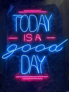 a neon sign that says today is a good day