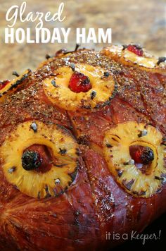 glazed holiday ham with pineapples and cherries on the top is ready to be eaten