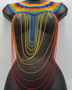 Show off some authentic, trendy, handmade, and vibrant designs from different regions in Africa!   Strut a new Waanje beaded necklace 😍 Place your orders NOW for this gorgeous and unique jewelry piece. Only one left!! ❤️ Unique Rainbow Beaded Necklaces, Handmade Rainbow Beaded Necklace For Festivals, Artisan Rainbow Beaded Necklace, Handmade Rainbow Beads For Festival, Handmade Rainbow Beads For Festivals, Handmade Bohemian Rainbow Beads, Bohemian Rainbow Polished Beads, African Beaded Necklace, African Beads Necklace